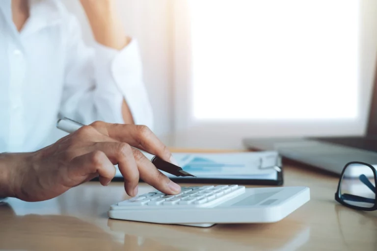 a female accountant using a calculator