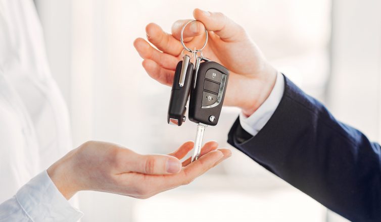 man handing a woman car keys