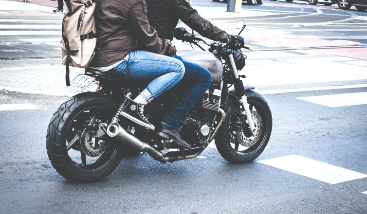Two Person Riding Gray Cafe Racer