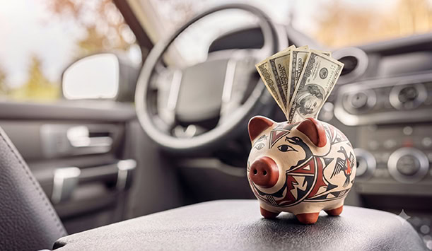 A New Mexico pottery piggy bank inside a vehicle illustrating the concept of an auto title loan